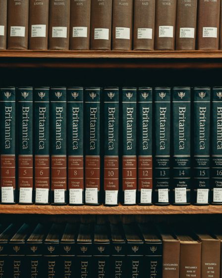 books on brown wooden shelf